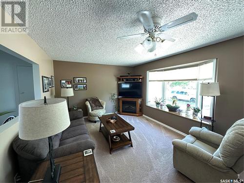 302 3Rd Avenue E, Assiniboia, SK - Indoor Photo Showing Living Room With Fireplace