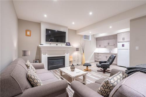 Rec Room with Gas Fireplace - ( Foot Ceilings. - 36 Kingspoint Circle, Stoney Creek, ON - Indoor Photo Showing Living Room With Fireplace