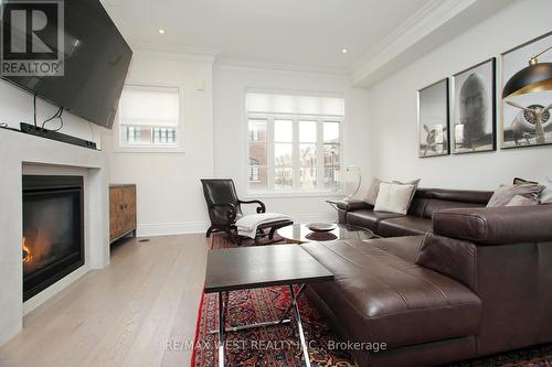 59 - 2092 Queensborough Gate, Mississauga, ON - Indoor Photo Showing Living Room With Fireplace