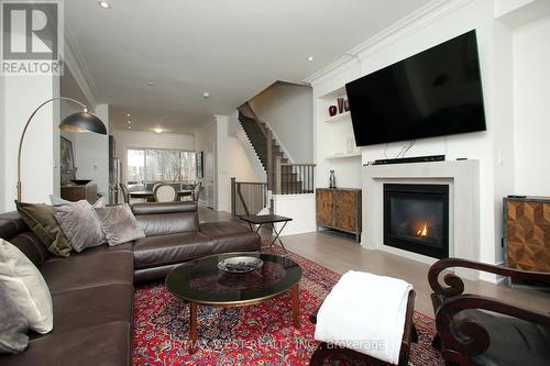 59 - 2092 Queensborough Gate, Mississauga, ON - Indoor Photo Showing Living Room With Fireplace