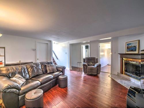 Family room - 114 Rue Lorenzo-Bourcier, Saint-Jérôme, QC - Indoor Photo Showing Living Room With Fireplace