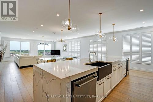 41x21 ft main room; 14x4 ft island with waterfall - 1103 - 260 Villagewalk Boulevard, London, ON - Indoor Photo Showing Kitchen With Upgraded Kitchen