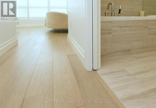 Smooth transitions between flooring types. - 1103 - 260 Villagewalk Boulevard, London, ON - Indoor Photo Showing Other Room