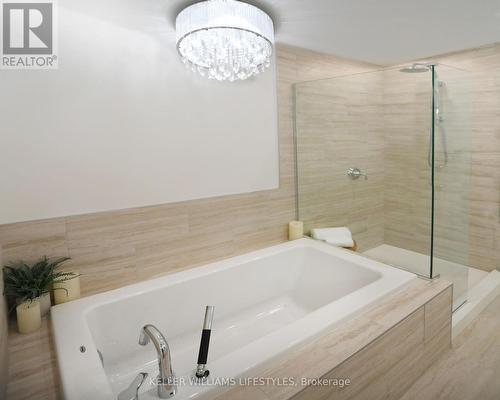 Upgraded fixtures and coni marble shower bases; - 1103 - 260 Villagewalk Boulevard, London, ON - Indoor Photo Showing Bathroom