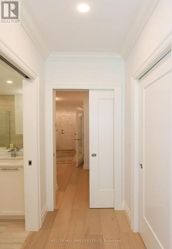 Pocket doors throughout past entryway - 1103 - 260 Villagewalk Boulevard, London, ON - Indoor Photo Showing Other Room