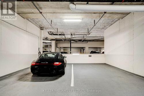 2 over-sized side-by-side walled parking spots - 1103 - 260 Villagewalk Boulevard, London, ON - Indoor Photo Showing Garage