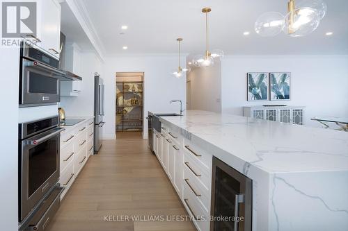 36\"wall oven, convect oven & warmer + wine fridge - 1103 - 260 Villagewalk Boulevard, London, ON - Indoor Photo Showing Kitchen With Upgraded Kitchen