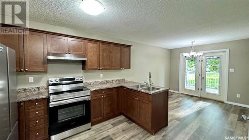 12 4-1275 Aaro Avenue, Elbow, SK - Indoor Photo Showing Kitchen With Double Sink