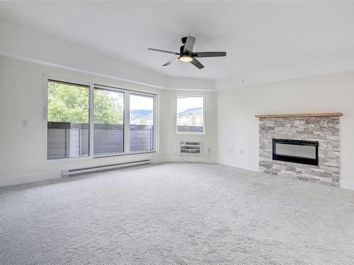 306-217 Elm Avenue, Penticton, BC - Indoor Photo Showing Living Room With Fireplace