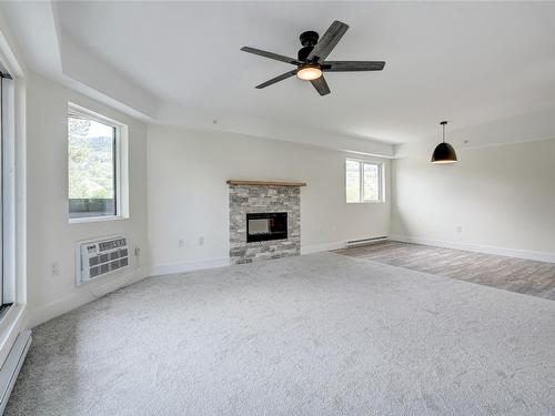 306-217 Elm Avenue, Penticton, BC - Indoor Photo Showing Living Room With Fireplace