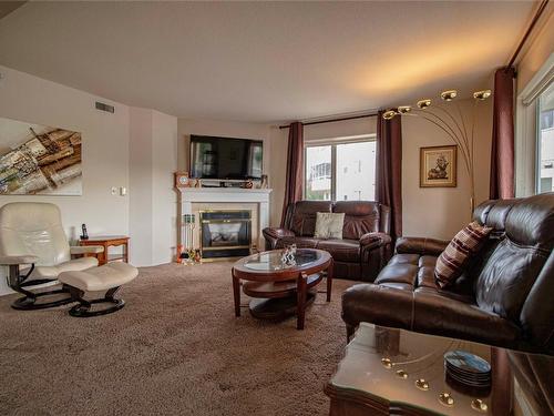 124-3595 Skaha Lake Road, Penticton, BC - Indoor Photo Showing Living Room With Fireplace