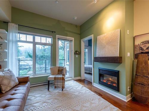 406-1375 Bear Mountain Pkwy, Langford, BC - Indoor Photo Showing Living Room With Fireplace