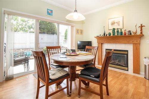 344-665 Cook Road, Kelowna, BC - Indoor Photo Showing Dining Room With Fireplace