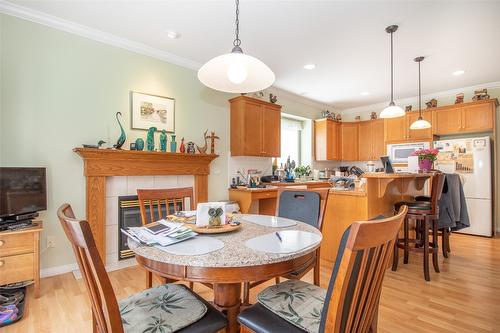 344-665 Cook Road, Kelowna, BC - Indoor Photo Showing Dining Room With Fireplace