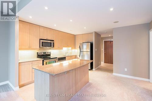 907 - 33 Ellen Street, Barrie, ON - Indoor Photo Showing Kitchen With Double Sink