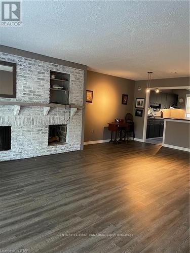 710 Wonderland Road S, London, ON - Indoor With Fireplace