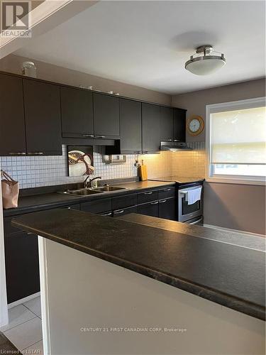 710 Wonderland Road S, London, ON - Indoor Photo Showing Kitchen With Double Sink