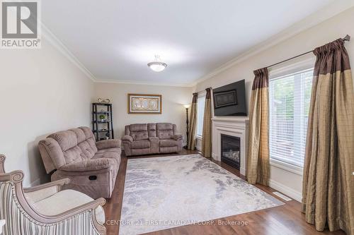 1025 Gleneagle Trail, London, ON - Indoor Photo Showing Living Room With Fireplace
