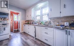 Kitchen is bright with plenty of cupboard and countertop space - 