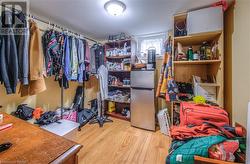 Basement den, used as walk-in closet space - 