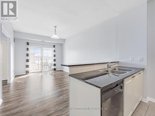 104 - 1 Sidney Lane, Clarington, ON - Indoor Photo Showing Kitchen With Double Sink