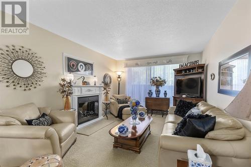 89 Pine St # 308, Sault Ste. Marie, ON - Indoor Photo Showing Living Room With Fireplace