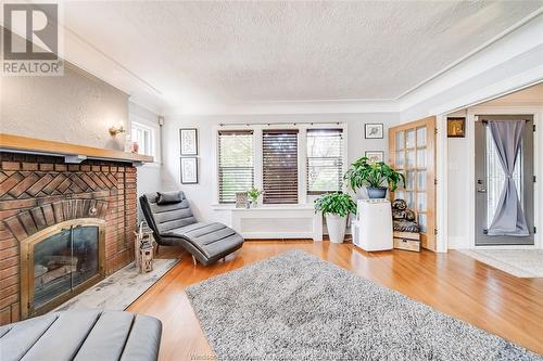 2419 Westminster, Windsor, ON - Indoor Photo Showing Living Room With Fireplace