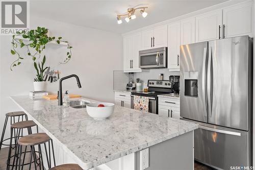 643 Kolynchuk Court, Saskatoon, SK - Indoor Photo Showing Kitchen With Stainless Steel Kitchen With Double Sink With Upgraded Kitchen