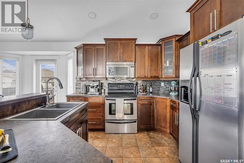 230 Lakeridge Drive, Warman, SK - Indoor Photo Showing Kitchen With Double Sink