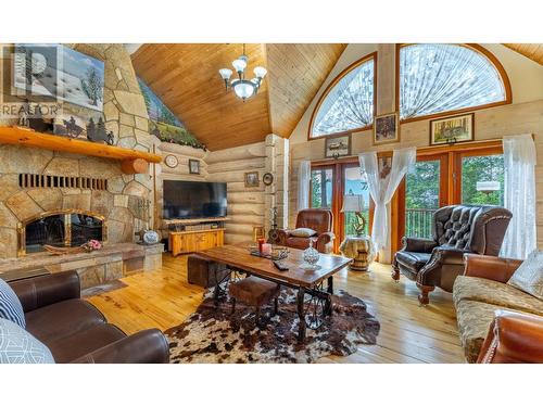 1958 Rykerts Road, Lister, BC - Indoor Photo Showing Living Room With Fireplace