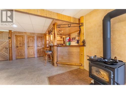 1958 Rykerts Road, Lister, BC - Indoor Photo Showing Other Room With Fireplace