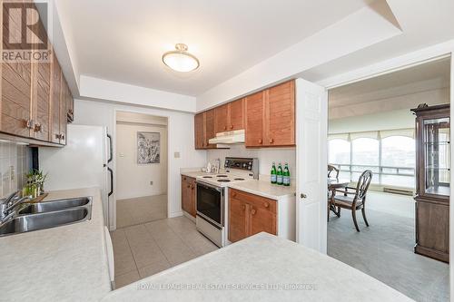 801 - 2180 Marine Drive, Oakville, ON - Indoor Photo Showing Kitchen With Double Sink