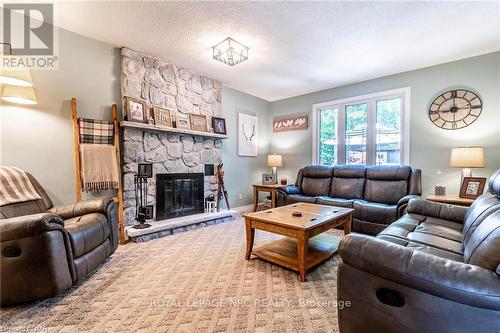 9 Hilda Street, Welland, ON - Indoor Photo Showing Living Room With Fireplace