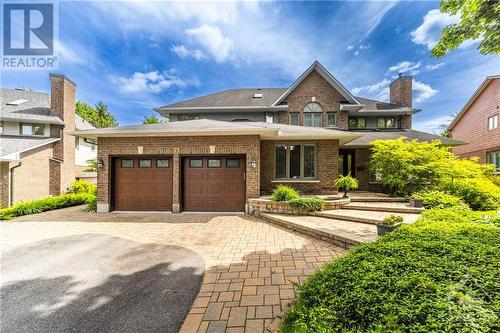 Welcoming landscaping leads to the covered front door. - 37 Slade Crescent, Ottawa, ON - Outdoor With Facade