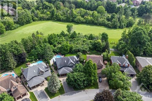 Welcome to 37 Slade Crescent in Kanata Lakes! Set on a large pie-shaped lot, this executive single family home with no rear neighbours enjoys peaceful moments in the backyard with in-ground pool & - 37 Slade Crescent, Ottawa, ON - Outdoor