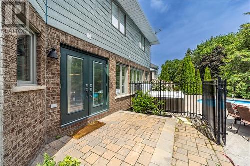 Landscaped backyard with interlock leads to amazing spaces that can be used year-round - 37 Slade Crescent, Ottawa, ON - Outdoor With Exterior