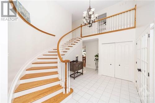 A grand staircase in the foyer sets the tone for a relaxed atmosphere - 37 Slade Crescent, Ottawa, ON - Indoor Photo Showing Other Room