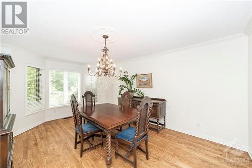 The dining room with large window looks out into the very large & very private backyard - 37 Slade Crescent, Ottawa, ON - Indoor Photo Showing Dining Room