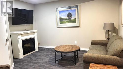 2450 Radio Tower Road Unit# 209, Oliver, BC - Indoor Photo Showing Living Room With Fireplace