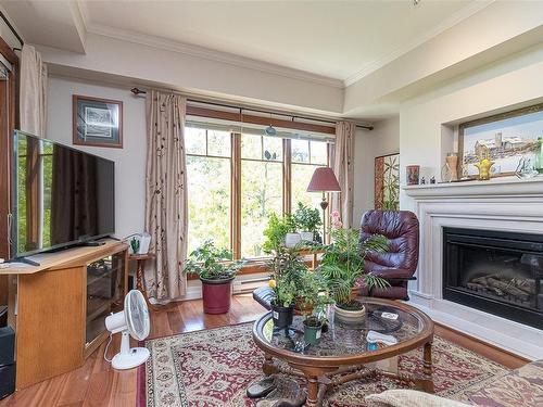 304-2006 Troon Crt, Langford, BC - Indoor Photo Showing Living Room With Fireplace