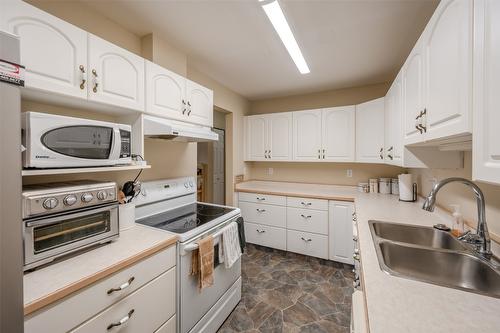 105-2401 South Main Street, Penticton, BC - Indoor Photo Showing Kitchen With Double Sink