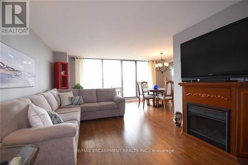 1610 - 2055 Upper Middle Road, Burlington, ON - Indoor Photo Showing Living Room With Fireplace