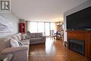 1610 - 2055 Upper Middle Road, Burlington, ON  - Indoor Photo Showing Living Room With Fireplace 