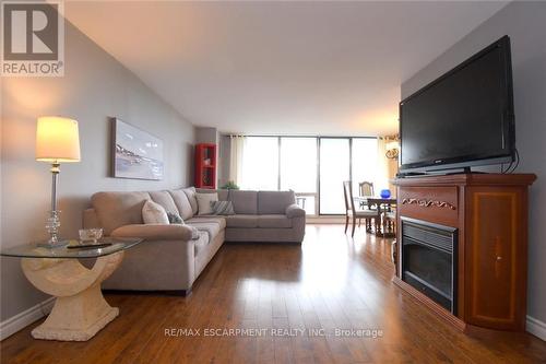 1610 - 2055 Upper Middle Road, Burlington, ON - Indoor Photo Showing Living Room With Fireplace