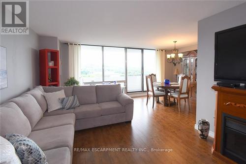 1610 - 2055 Upper Middle Road, Burlington, ON - Indoor Photo Showing Living Room With Fireplace