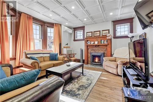 1031 Carling Avenue, Ottawa, ON - Indoor Photo Showing Living Room With Fireplace