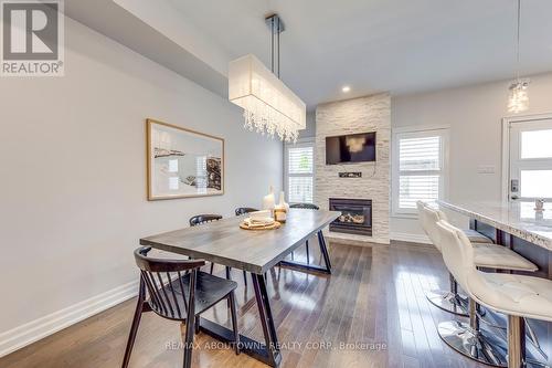 261 Gatwick Drive, Oakville, ON - Indoor Photo Showing Dining Room With Fireplace