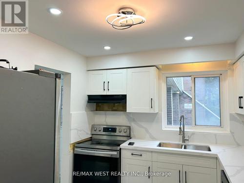 29 - 433 Silverstone Drive, Toronto, ON - Indoor Photo Showing Kitchen With Double Sink