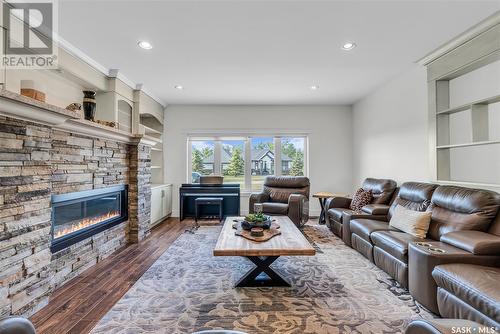 426 Greenbryre Lane, Greenbryre, SK - Indoor Photo Showing Living Room With Fireplace