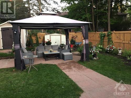 Summer photo of Fenced Backyard - 1 Furlong Crescent, Ottawa, ON - Outdoor With Deck Patio Veranda